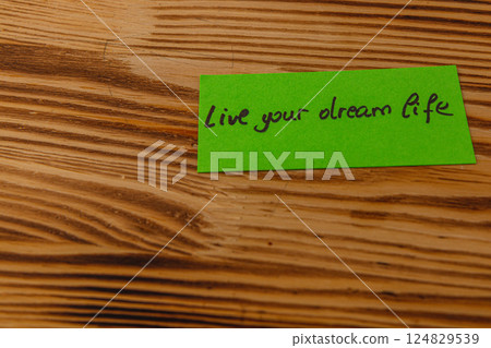 Inspirational note urging individuals to pursue their dreams and aspirations Inspirational note urging individuals to pursue their dreams and aspirations 124829539