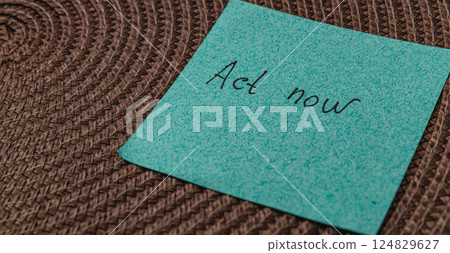 Reminder note on a textured surface encouraging immediate action Reminder note on a textured surface encouraging immediate action 124829627