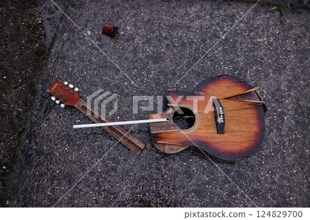 Broken guitar in snowy rain Broken guitar in snowy rain 124829700
