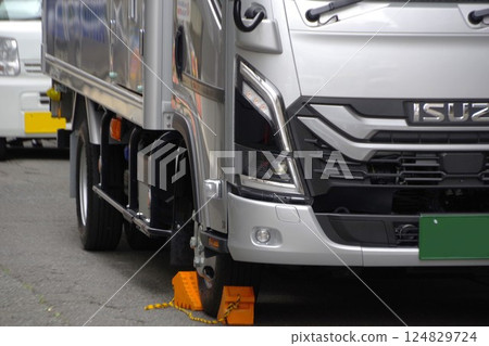 Commercial vehicle image: Truck with wheels blocked during delivery 124829724