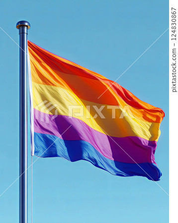 Vibrant rainbow flag waving against clear blue sky, pride in the LGBTQ community Vibrant rainbow flag waving against clear blue sky, pride in the LGBTQ community 124830867