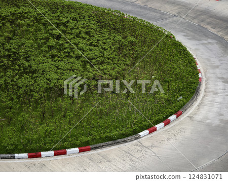 Expansive aerial view capturing a parking lot with arrows guiding vehicles to their destinations 124831071