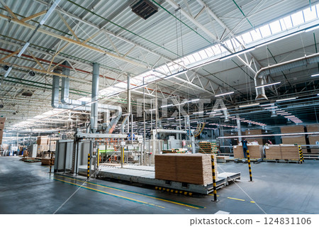 Production line of the wooden floor factory. CNC automatic woodworking machine. 124831106