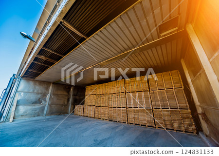 Lumber ready for loading into a dry kiln. Wood drying in containers Lumber ready for loading into a dry kiln. Wood drying in containers 124831133