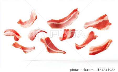 Slices Of Beef And Pork Bacon Flying In The Air On A White Background, With Sliced Bacons Floating In Mid-Air. Slices Of Beef And Pork Bacon Flying In The Air On A White Background, With Sliced Bacons Floating In Mid-Air. 124831982