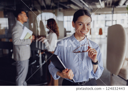 Business Professionals Collaborating Effectively in a Modern Office Environment Setting 124832443