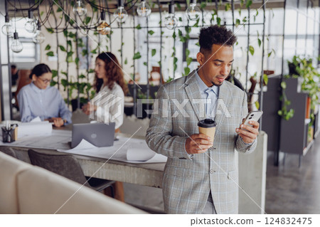 Modern professionals collaborating in a stylish office that inspires creativity and innovation 124832475