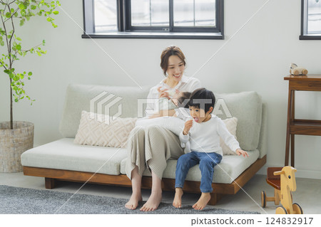 A family relaxing in the living room A family relaxing in the living room 124832917