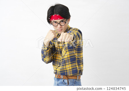 Akihabara-style male punching white background looking at camera Akihabara-style male punching white background looking at camera 124834745