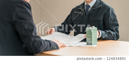 Display title candidates Young Asian businessman in work clothes having a business meeting Display title candidates Young Asian businessman in work clothes having a business meeting 124834891
