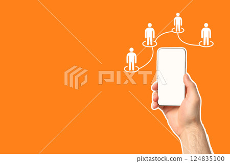 Hand holds a smartphone, representing digital communication and social networking Hand holds a smartphone, representing digital communication and social networking 124835100