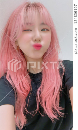 Asian woman taking a selfie Asian woman taking a selfie 124836197