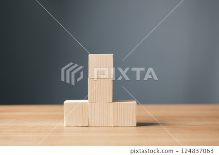 wood empty five blocks stack on table and gray background with copy space for text or symbols, development concept for growth success process. wood empty five blocks stack on table and gray background with copy space for text or symbols, development concept for growth success process. 124837063