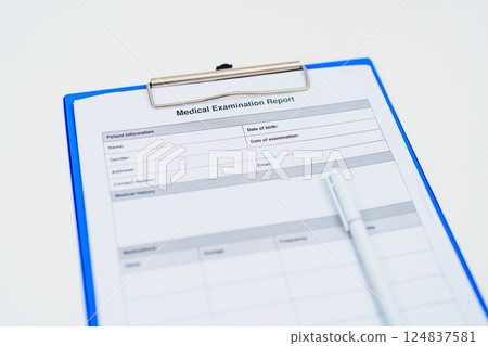medical examination report form on blue clipboard with white pen of doctor. healthcare documentation, medical records, medical consulting, health checkup and examination concepts medical examination report form on blue clipboard with white pen of doctor. healthcare documentation, medical records, medical consulting, health checkup and examination concepts 124837581