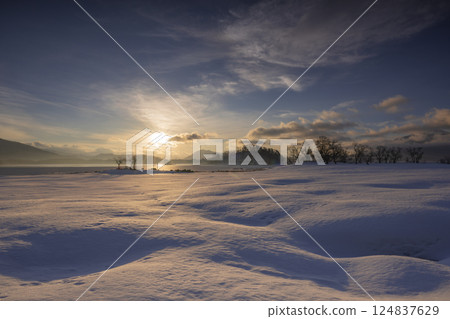 Asahi rising on the snowy field Asahi rising on the snowy field 124837629