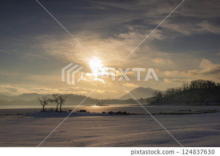 Asahi rising on the snowy field Asahi rising on the snowy field 124837630