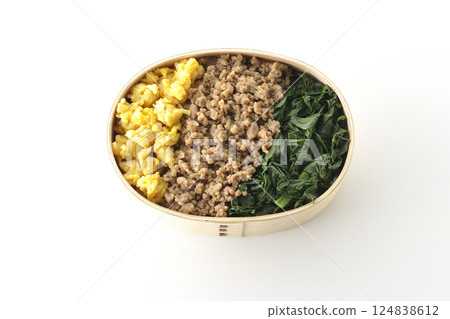 Three-color bento box with egg, meat, and spinach photographed on white background Three-color bento box with egg, meat, and spinach photographed on white background 124838612