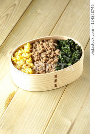 Three-color bento box with egg, meat, and spinach Three-color bento box with egg, meat, and spinach 124838746