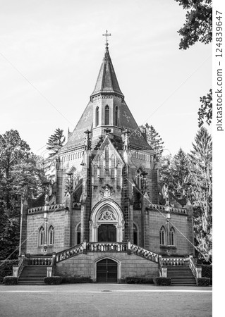 In Domanin, Czechia, the Schwarzenberg Tomb stands majestically, showcasing intricate architecture surrounded by lush greenery. This site reflects historical significance and gothic design. 124839647