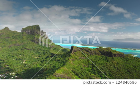 Impressive aerial view of bora bora island, french polynesia, revealing the iconic mount otemanu surrounded by turquoise waters and lush vegetation 124840586