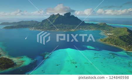 Aerial panorama Bora Bora island, French Polynesia: stunning turquoise lagoon, coral reefs, towering mountain otemanu breathtaking scene. Remote wild nature paradise, exotic summer travel. Drone shot 124840598