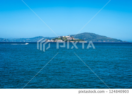 Alcatraz Island surrounded by blue waters in San Francisco Bay, USA 124840903
