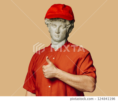 Antique statue in red beanie 124841196