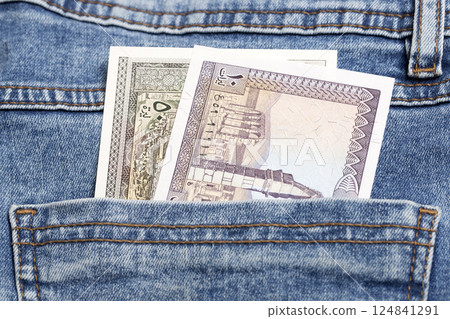 Old Lebanese pound in the pocket of blue jeans Old Lebanese pound in the pocket of blue jeans 124841291