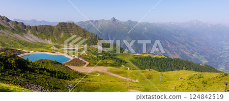 Scenic alpine landscape Kals Grossglockner valley with blue artificial lake Tyrol mountains nature background. Panoramic view Alps summer hiking trail adventure tourism recreational area Scenic alpine landscape Kals Grossglockner valley with blue artificial lake Tyrol mountains nature background. Panoramic view Alps summer hiking trail adventure tourism recreational area 124842519