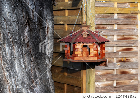 Wooden bird feeder. 124842852