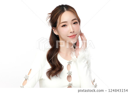 A beautiful young Asian woman with clean, fresh skin against a white background. Skincare, facial treatment, cosmetology, beauty, and spa. An elegant portrait of an Asian woman. A beautiful young Asian woman with clean, fresh skin against a white background. Skincare, facial treatment, cosmetology, beauty, and spa. An elegant portrait of an Asian woman. 124843154