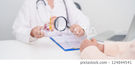 Elderly Patient consulting Doctor to Ear disease. Senior Health Medical Diagnosis. Anatomy Ear model for Atresia, Otitis Media, Pertorated Eardrum, Meniere syndrome, otolaryngologist, Hearing Loss Elderly Patient consulting Doctor to Ear disease. Senior Health Medical Diagnosis. Anatomy Ear model for Atresia, Otitis Media, Pertorated Eardrum, Meniere syndrome, otolaryngologist, Hearing Loss 124844541