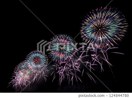 Colorful fireworks burst into the night sky Colorful fireworks burst into the night sky 124844780