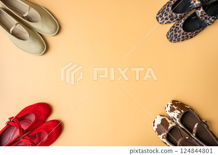 Assorted spring fashion ballet flats in vibrant and apricot tones with copy space 124844801
