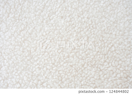 A highly detailed close-up of fluffy white sherpa fleece with a textured surface A highly detailed close-up of fluffy white sherpa fleece with a textured surface 124844802