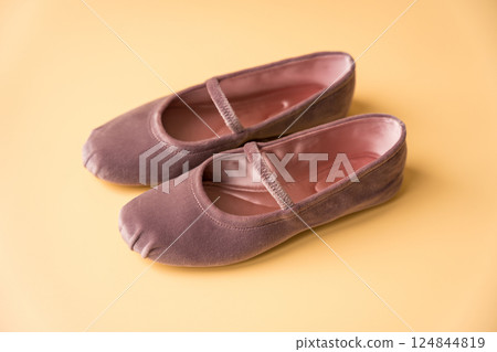 Velvet ballet flats in dusty pink on soft neutral background 124844819
