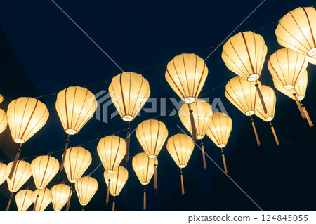 Traditional Asian lanterns glow with warm light creating festive magic and cultural charm, Colorful handmade lights illuminate space radiating beauty and heritage Traditional Asian lanterns glow with warm light creating festive magic and cultural charm, Colorful handmade lights illuminate space radiating beauty and heritage 124845055