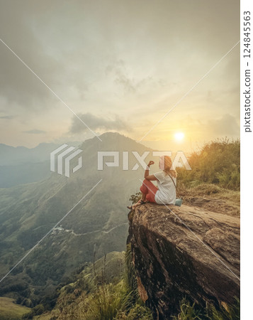 Blonde woman and sunset at Little Adam's Peak, Sri Lanka 124845563