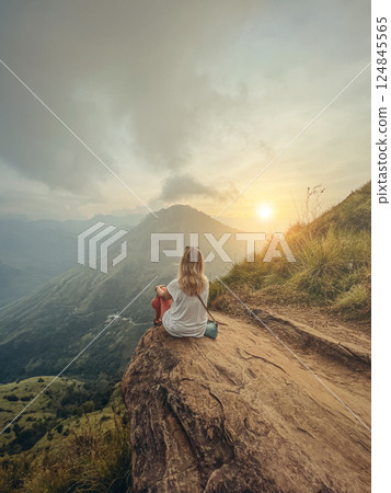 Blonde woman and sunset at Little Adam's Peak, Sri Lanka Blonde woman and sunset at Little Adam's Peak, Sri Lanka 124845565
