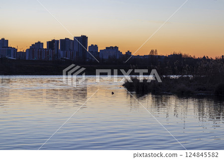 Sun set over a large water reservoir Sun set over a large water reservoir 124845582