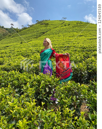 Woman in sari on tea plantations 124845589