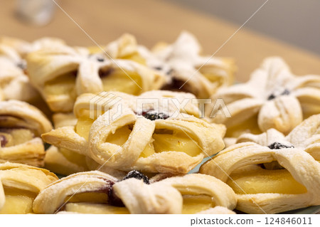 Freshly baked fruit puff pastries on the ceramic plate Freshly baked fruit puff pastries on the ceramic plate 124846011