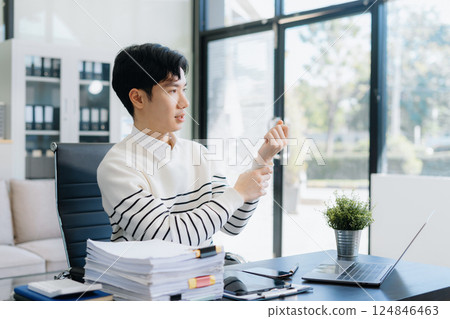 Male have wrist pain after work hard in office feeling so pain and illness with Office syndrome symptom, healthcare office syndrome concept. Male have wrist pain after work hard in office feeling so pain and illness with Office syndrome symptom, healthcare office syndrome concept. 124846463