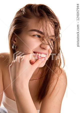 Emotional, young female fashionista posing showing modern stylish silver rings against white background, highlighting her individuality. 124847944