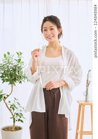 Female with mouthpiece correction 124848984