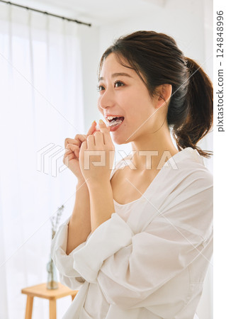 A woman wearing a mouthpiece 124848996