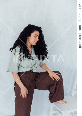 Woman Brunette in Home Clothes Portrait on White Background 124849456