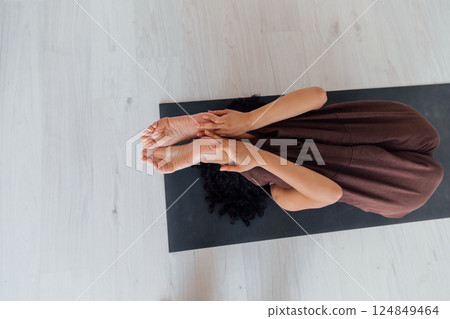Yogi woman brunette doing asana gymnastics 124849464