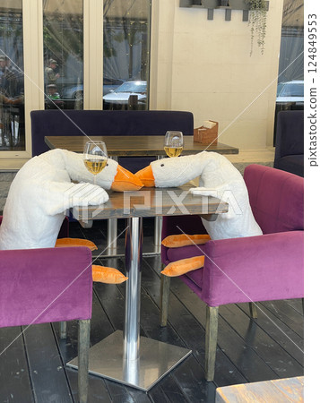 Two goose with a glass of wine Two goose with a glass of wine 124849553