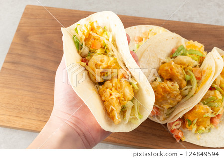 Shrimp Tacos with Shrimp, Vegetables, and Spices Wrapped in Tortillas Shrimp Tacos with Shrimp, Vegetables, and Spices Wrapped in Tortillas 124849594